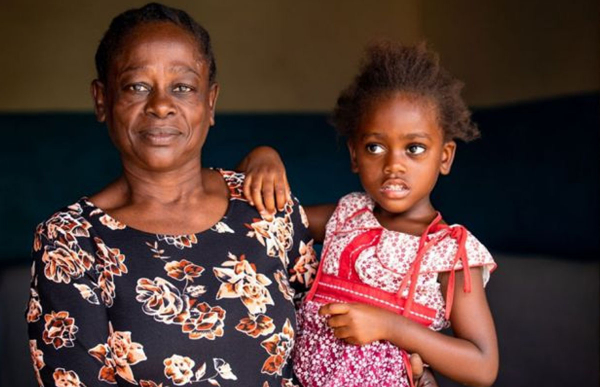 Caroline Damiani, and her granddaughter Nancy Saidi, at her home. Temeke, Dar es Salaam, Tanzania, 13 November 2020. Credit: UNAIDS/Daniel Msirikale
